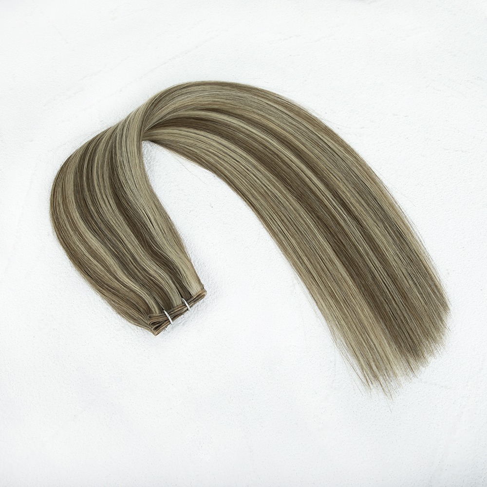 Long, straight, light brown hair extensions arranged elegantly on a white background, showcasing their smooth texture and versatility for styling.