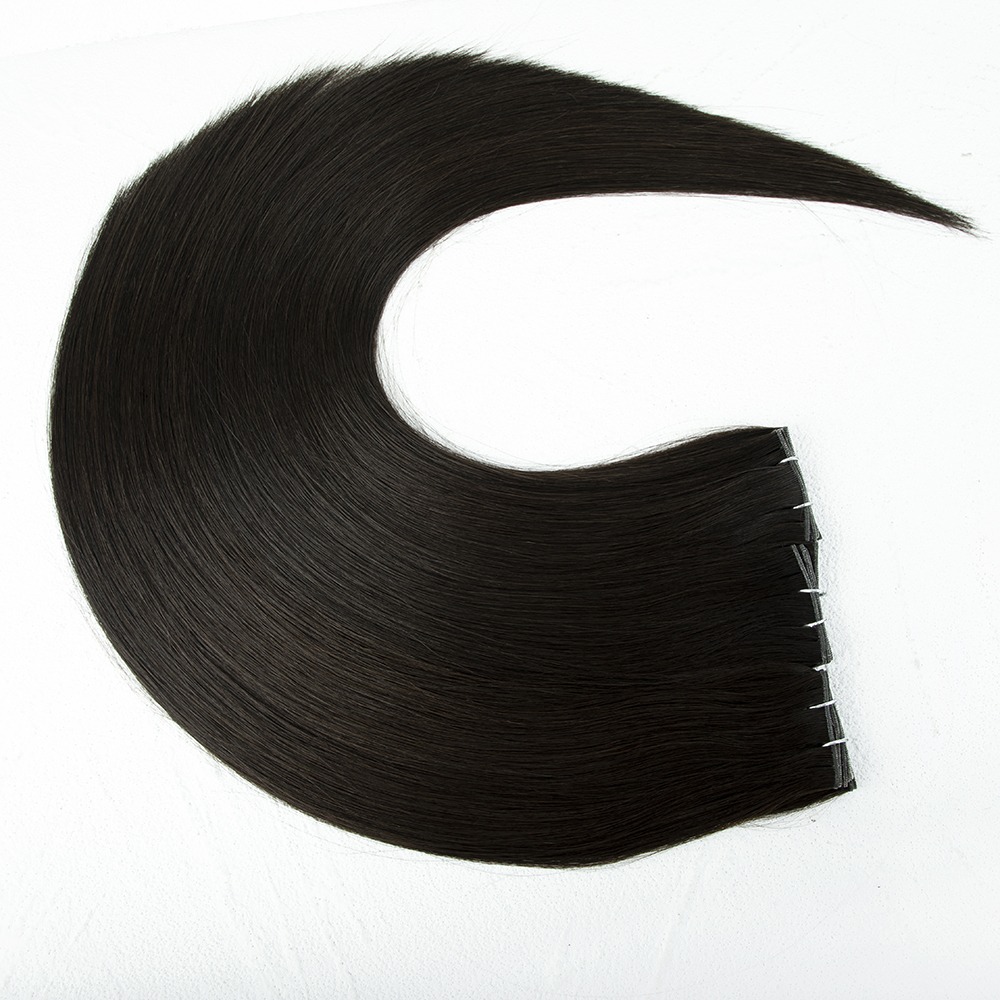 Long, sleek, dark hair extension displayed in a circular shape, showcasing its smooth texture and clipped base, ideal for styling versatility.