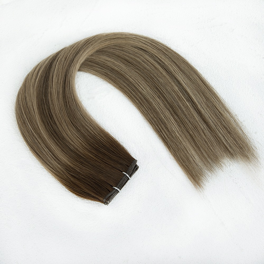 Long, straight hair extensions in light brown and blonde shades, showcasing a gradient effect. Ideal for enhancing hair length and style.