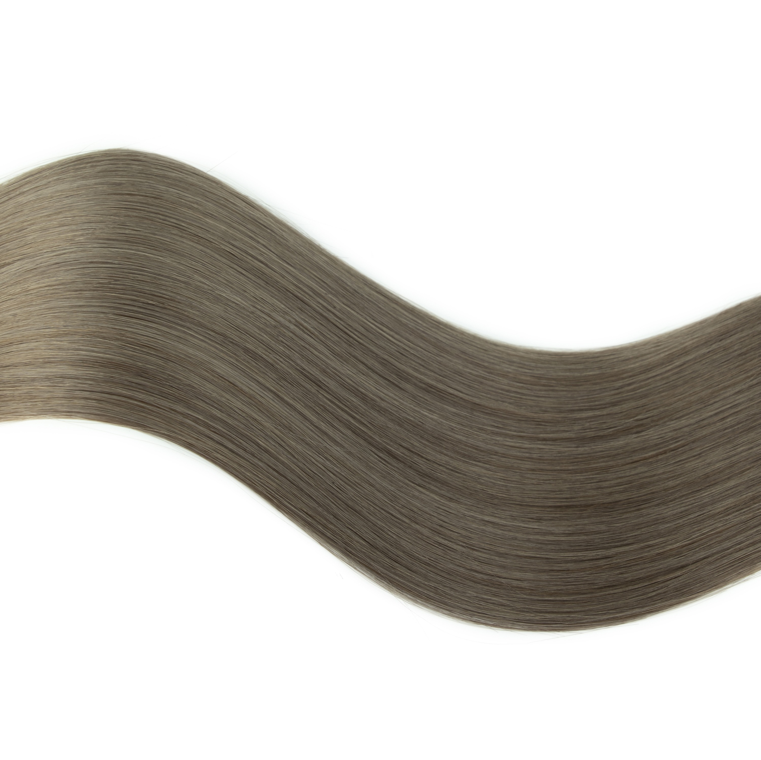 Smooth, wavy strands of long, medium ash brown hair against a white background, showcasing texture and color for hair care or styling purposes.
