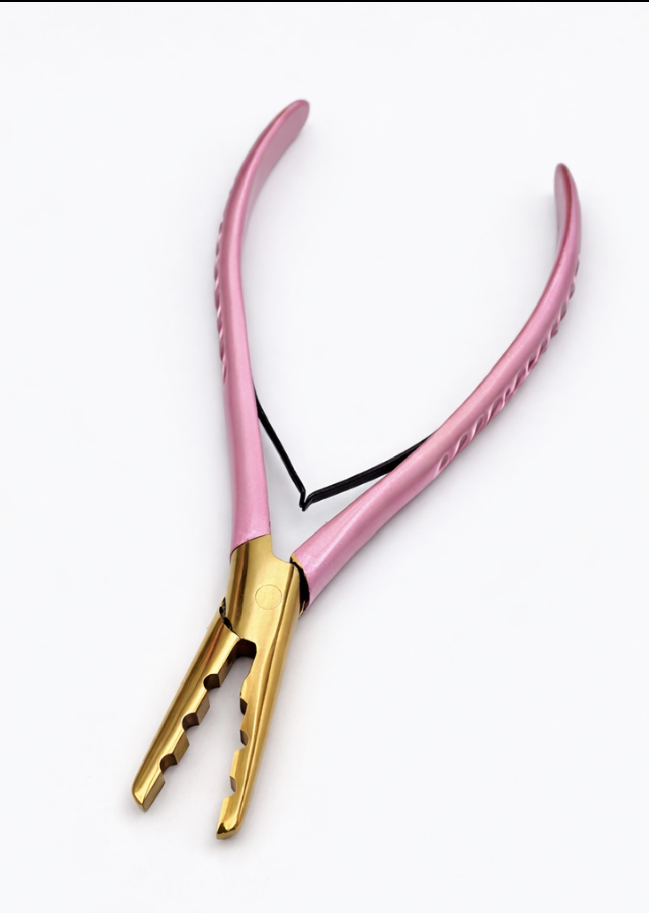 Gold and pink pliers designed for gripping and holding objects, showcasing tools essential for various DIY projects or jewelry making.